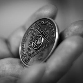 An Alcoholics Anonymous sobriety token.