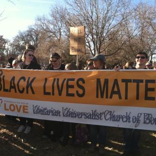 Members of the UU Church of Boulder, Colorado, with their Black Lives Matter banner at the annual “MLK Marade” at City Park in Denver, January 19, 2015.