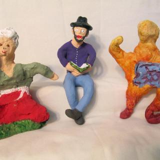 three clay figures created by members