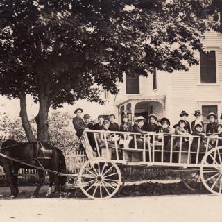Archival photo shows a May Day wagon party outside First Universalist Church in Yarmouth, Maine.