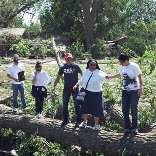 An interfaith group surveys tornado damage in Oklahoma City, Okla., as it sought to provide relief to undocumented immigrants.