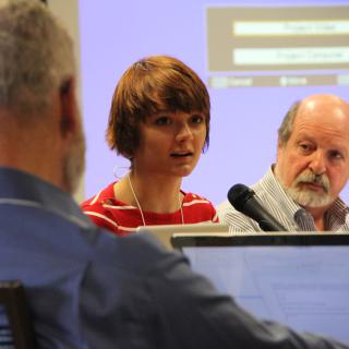 Youth observer Rosemary Dodd (center) speaks during the January 2013 Board of Trustees meeting as trustees Lew Phinney (left) and the Rev. Rob Eller-Isaacs listen