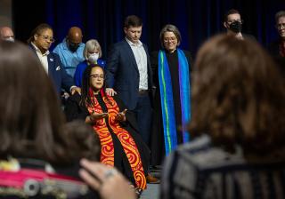 Rev. Dr. Sofía Betancourt surrounded by family and colleagues during a laying on of hands