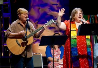 Kiya Heartwood and the Rev. Kimberley Debus perform their new song, "Are All Called"—the theme of GA 2018—during the Opening Celebration's worship service.