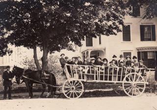 Archival photo shows a May Day wagon party outside First Universalist Church in Yarmouth, Maine.