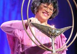 Mariela Pérez-Simons lights the chalice during the opening celebration of the 2019 UUA General Assembly in Spokane, Washington, on Wednesday, June 19, 2019