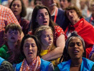 The audience sings during the opening celebration of the 2019 UUA General Assembly in Spokane, Washington.