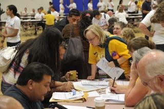 UU volunteers assist immigrants at a Naturalization and Citizenship Fair in Phoenix.