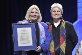 Judith Frediani presented the Rev. Dr. Linda Olson Peebles with an award recognizing her contributions to religious education on Saturday. Frediani was honored in turn for leading the Tapestry of Faith program during Sunday morning's plenary.