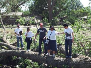 An interfaith group surveys tornado damage in Oklahoma City, Okla., as it sought to provide relief to undocumented immigrants.