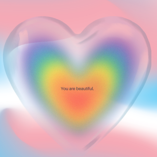 The words "You are beautiful" in the center of a rainbow heart with the lovely colors of the Transgender Pride Flag wrapping it all together. 