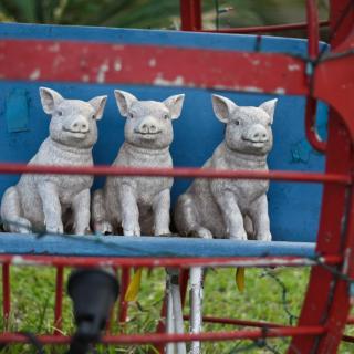 Three little pigs, salvaged carnival ride seat