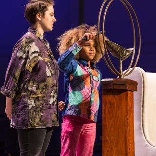 Amelia Diehl and Levi Draheim light the chalice during the 2019 Service of Living Tradition in Spokane, Washington