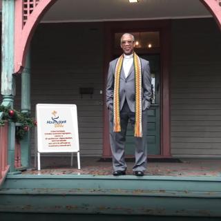 The Rev. Duncan Teague on the porch of the Hammonds House Museum, which Abundant LUUv calls home.