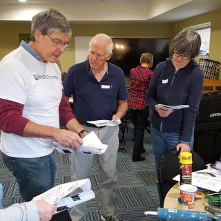 Eric Goplerud (in white T-shirt) shows volunteers from local congregations how to insulate buildings as part of a Faith Alliance for Climate Solutions event in Fairfax County, Virginia. 