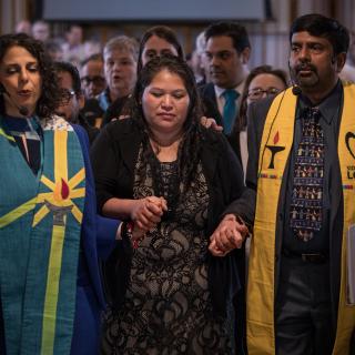 The Rev. Katie Romano Griffin and the Rev. Abhi Janamanchi escort Rosa Gutierrez Lopez from a vigil and press conference to protest her deportation at Cedar Lane UU Church in Bethesda, Maryland, December 12, 2018.  