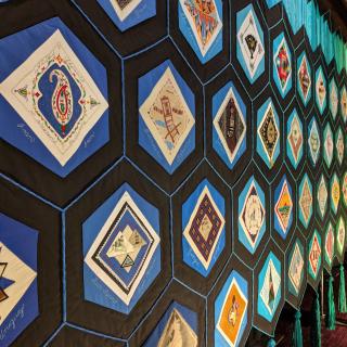 Photo of the Quilt of Belonging, taken at the 2018 Parliament of the World's Religions in Toronto Ontario.