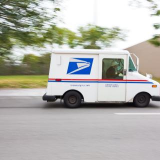 US postal truck driving quickly