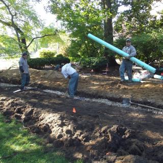 laying pipe for the rain garden