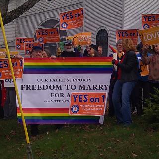 UUs rallied for marriage equality on the lawn of the First Universalist Church of Pittsfield, Maine, which had its rainbow flag vandalized prior to the November 6 election.