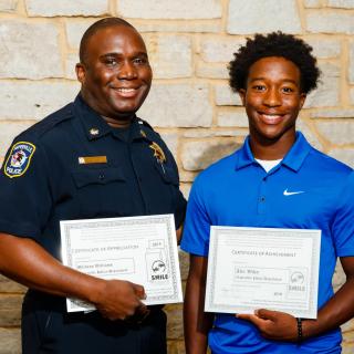 Commander Michaus Williams with mentee Alex Wiley, who spent four weeks interning with the Naperville Police.