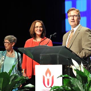 The Rev. Scott Tayler (right), director of Congregational Life, welcomed the Unitarian Universalists of Benton County in Bentonville, Arkansas, as a new member congregation of the Unitarian Universalist Association.