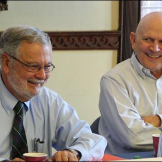 UUA President Peter Morales and Moderator Jim Key laughed during a presentation by the Rev. Harlan Limpert, chief operating officer, at the October 17–20 meeting of the UUA Board of Trustees in Boston