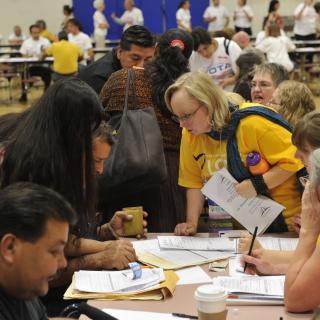 UU volunteers assist immigrants at a Naturalization and Citizenship Fair in Phoenix.