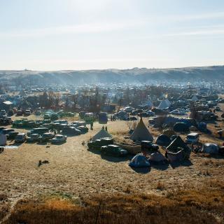The sun rises over the Oceti Sakowin Camp on  the Standing Rock Sioux Reservation in Cannon Ball, North Dakota, on November 26, 2016.