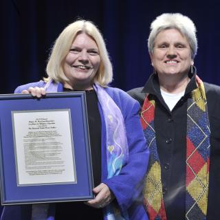 Judith Frediani presented the Rev. Dr. Linda Olson Peebles with an award recognizing her contributions to religious education on Saturday. Frediani was honored in turn for leading the Tapestry of Faith program during Sunday morning's plenary.