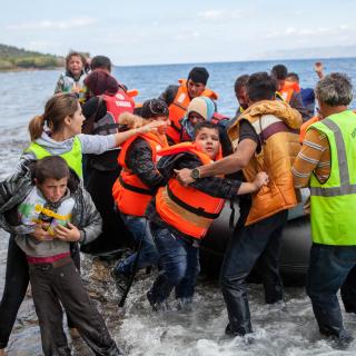 refugee raft arrives in Greece, October 2, 2015