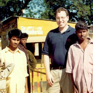 Dr. Seth Frisbie (center) travels frequently from Vermont to Bangladesh to measure arsenic levels in drinking water and help people identify the safest wells to use.