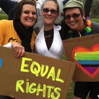 Jamie Crispin, Kimberly Daughtery, and Sara O'Keeffe celebrate after the Million 'Fag' March  held in May in Topeka.