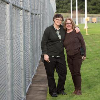 Prison chaplains the Rev. Dr. Emily Brault (left) and the Rev. Susan Matranga- Watson outside Coffee Creek Correctional Facility in Wilsonville, Oregon.