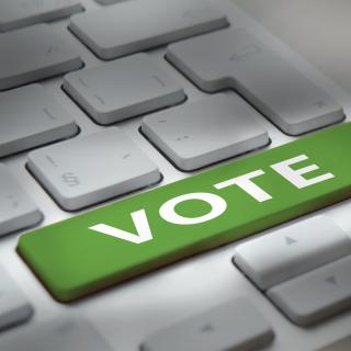 White computer keyboard with "vote" button stock photo
