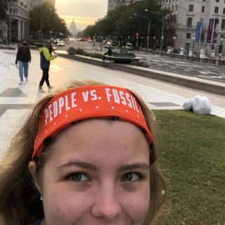 Selfie of Zoë Johnston in Washington, D.C., with the Capitol building in the background, October 15, 2021, to join in protest and arrest to demand climate action.