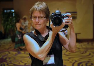 Photographer Nancy Pierce takes a picture of herself in front of a mirror