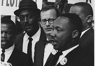 Rev. Dr. Martin Luther Luther King, Jr., and other Civil Rights movement allies at a demonstration.
