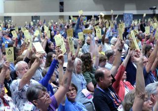 Delegates vote at the 2018 General Assembly to place three proposed Actions of Immediate Witness on the final agenda