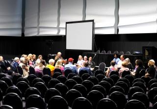 A small breakout group meeting in a large auditorium at 2018 General Assembly