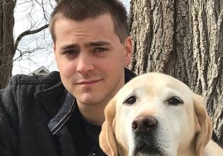 Nathan Selove and his autism service dog, Sylvia.