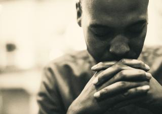 African American man praying