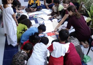 Jennifer and Bella  teach art to an all-ages group at the Children’s International Sahey Center in Calcutta