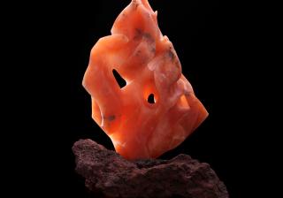 Sculpture: creations Fire. © 2012 Dale Niemann. Translucent orange alabaster and red lava stone. 22 x 14 x 12 inches.