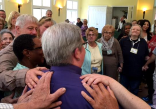 Members of the UU Congregation of the South Jersey Shore in Galloway, New Jersey, celebrate unanimously calling the Rev. Dawn Fortune as the congregation’s first settled minister in May 2017.