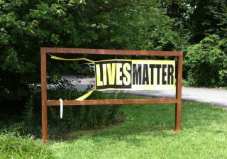 defaced Black Lives Matter banner