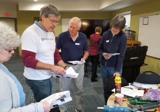 Eric Goplerud (in white T-shirt) shows volunteers from local congregations how to insulate buildings as part of a Faith Alliance for Climate Solutions event in Fairfax County, Virginia. 