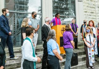 Religious leaders gather outside First  Unitarian Church in Louisville on September 25, 2020, in support of protesters. 