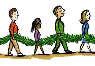 People with evergreen garland
