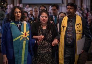 The Rev. Katie Romano Griffin and the Rev. Abhi Janamanchi escort Rosa Gutierrez Lopez from a vigil and press conference to protest her deportation at Cedar Lane UU Church in Bethesda, Maryland, December 12, 2018.  